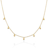 Necklace with seven hanging gold spheres